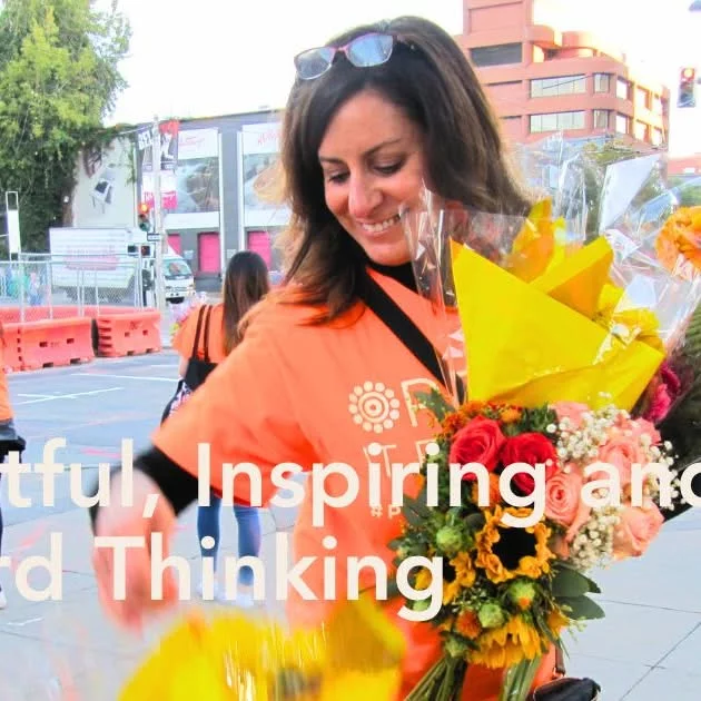 Vibrant display of various flower bouquets and market scenes.