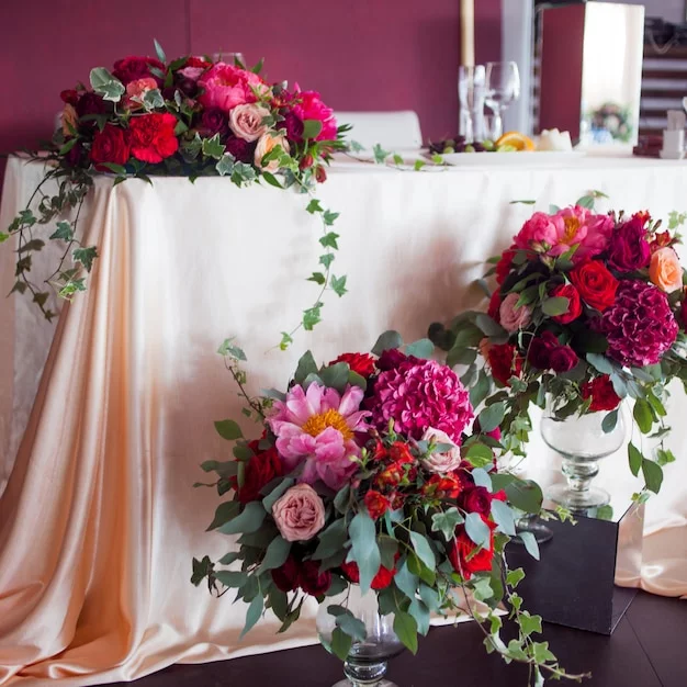 Elegant gala setting with floral arrangements.